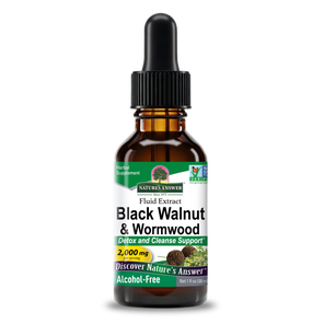 A 1 fl oz amber glass dropper bottle of Nature's Answer Black Walnut & Wormwood Fluid Extract, featuring a black dropper cap and a white label with green and yellow accents, set against a plain white background. 